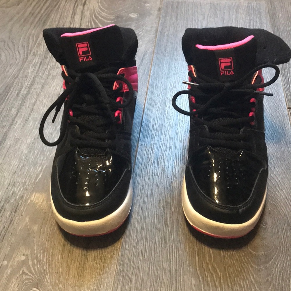 Good condition but worn Fila high top sneakers